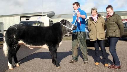 Tom Akrigg with his brother John’s Craven Champions Day supreme champion, joined by co-judges Annie Turnbull, left, and Lucy Corner.