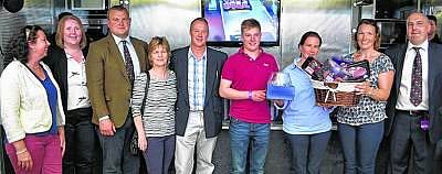 The Dawson and Gordon families receive their ASDA/ABP steak awards from ABP's Frank Ross