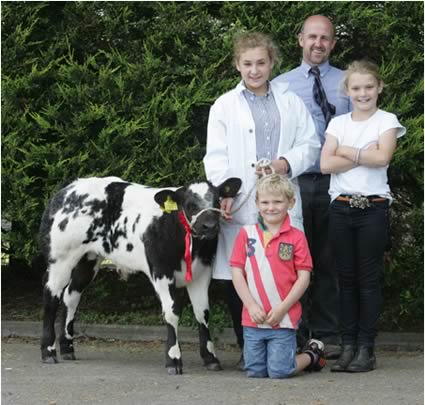 Bull class one winner was Emily Martin Oliver and Olivia Berry pictured with club vice chairman Jason Edgar representing Donnolly Group sponsors at the British Blue Calf show in Moira.