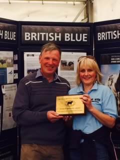Presentation by Judge, Graham Brindley to Nigel & Candy Jenkinson of the Dymond Blue Herd, winners of the Premier Breeder Award