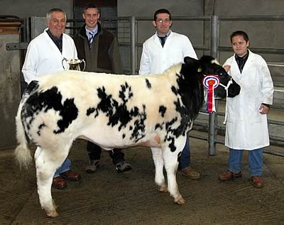 judge Phil Halhead presenting the cup to Rhys Bellis, who had the Supreme Champion with Betws Donna