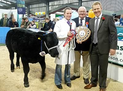 Winner of the young handlers, Lucy Corner from Darlington with Judge, Ted Haste and Adam Henson