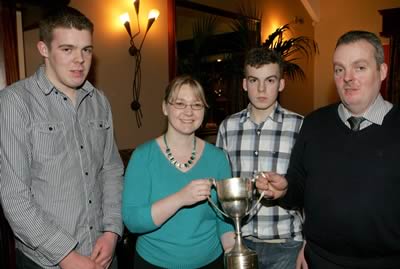 Ruth Rodgers presents Balmoral Champion to Stephen, Anthony and Oliver McGuinness