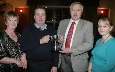 Ivan and Jean Porter from Osmonds Animal Health present Oliver McGuinness with the bull derby award, with Ruth Rodgers looking on