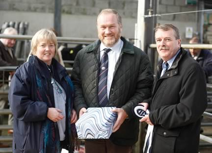 Club Secretary Libby Young presenting gift to the judge Samuel Cleland with sponsor Richard Graham from Danske Bank, Ballymena.
