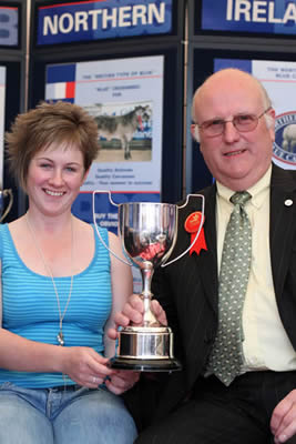 Zara Chestnutt, Bushmills receives the award for her Best Senior Blue Cow at Balmoral from Con Williamson, judge of the Blue classes.