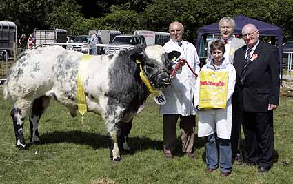 Zara Chestnutt winner of the British Blue Bull Derby with judge Ted Haste Sponsor Ivan Porter Osmonds and Handler Sam Milliken at the British Blue Derby