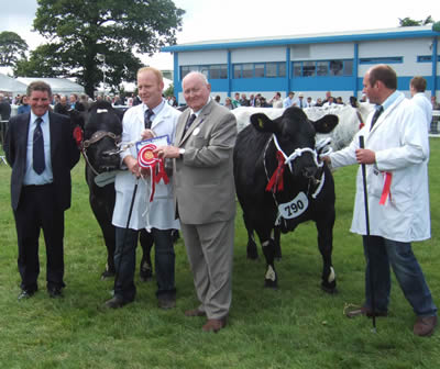 Judge, Jim Barber & President Ted Haste, with Champion & Reserve Female