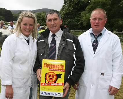 Louise McCarthy (Overall Reserve Champion winner) with Harold McKee Club Secretary and Mr Oliver McCann (Overall Supreme Champion winner)