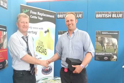 Jonathan Watson – Tweeddale Herd, receiving Premier Breeder & Exhibitor Awards from Graham Morgan